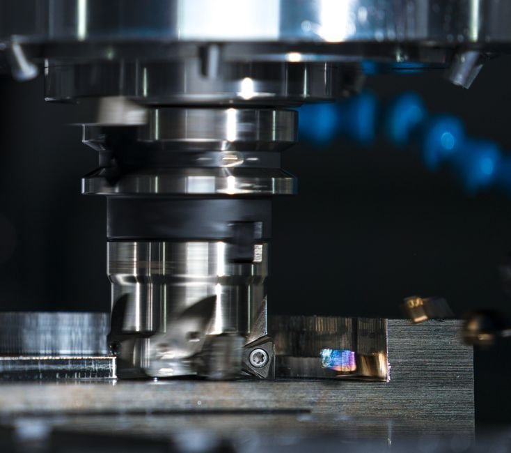 CNC milling center cutting a gear blank